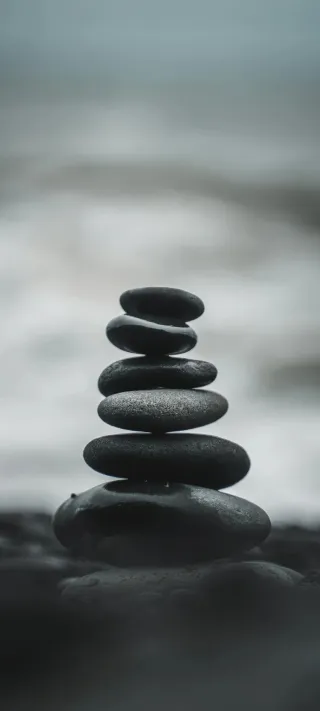 Minimalist Rock Cairn by the Sea phone wallpaper